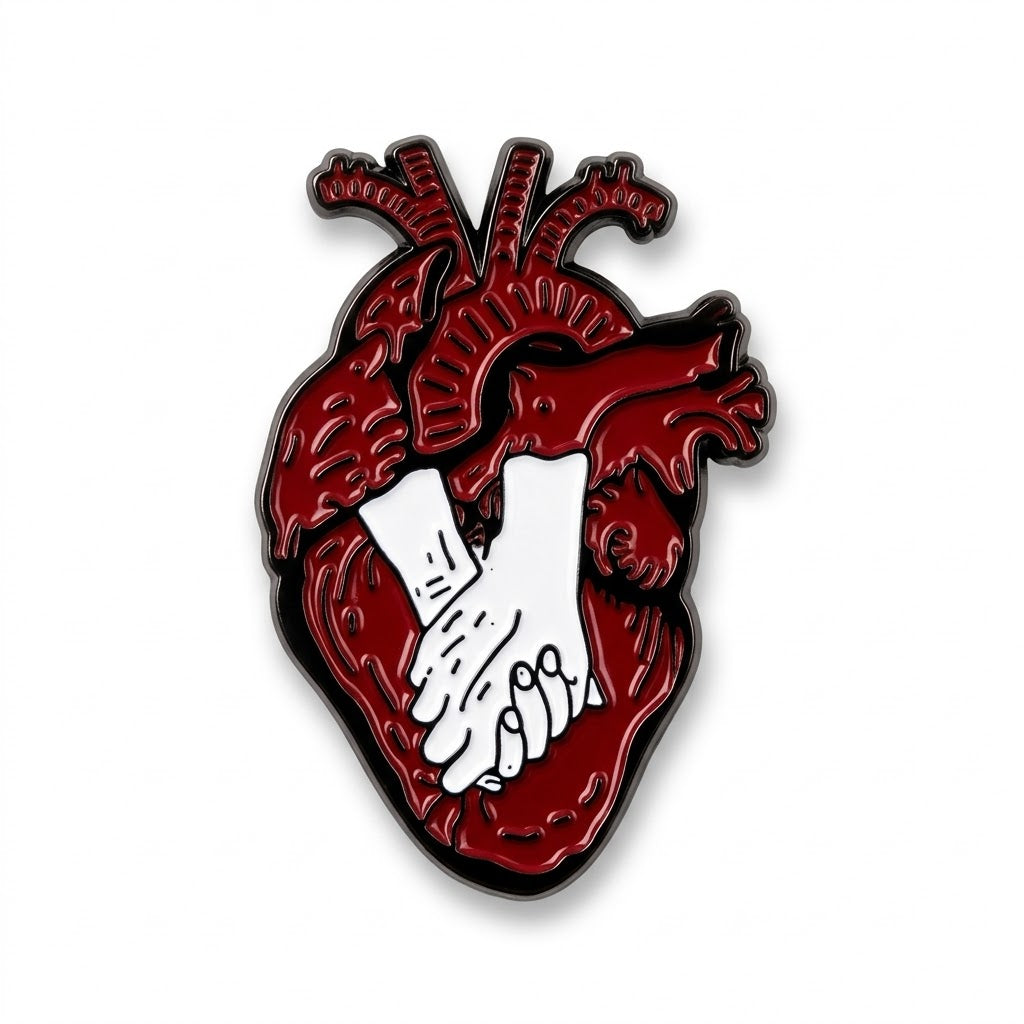 Anatomical red heart enamel metal brooch with white hands holding each other
